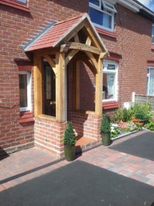 High Brick Plinth Porch Black Door Alt