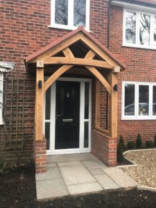 High Brick Plinth Porch Black Door