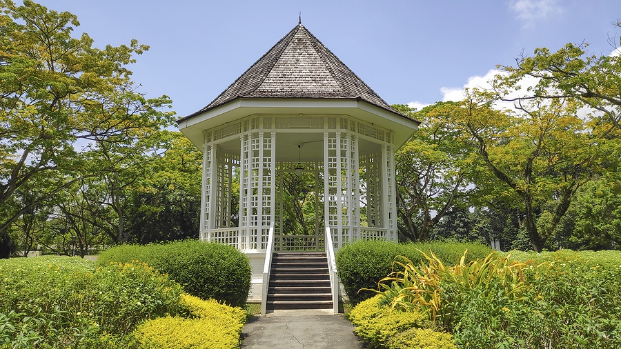 Gazebo or white bandstand at Singapore Botanic Gardens. The octagonal gazebo known as the Bandstand was erected in 1930 and has retained its original shape